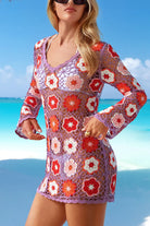 Woman wearing a colorful crochet dress with a beach background